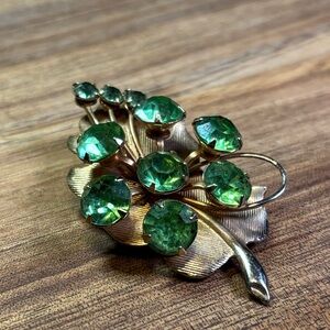 Brooch with green rhinestones